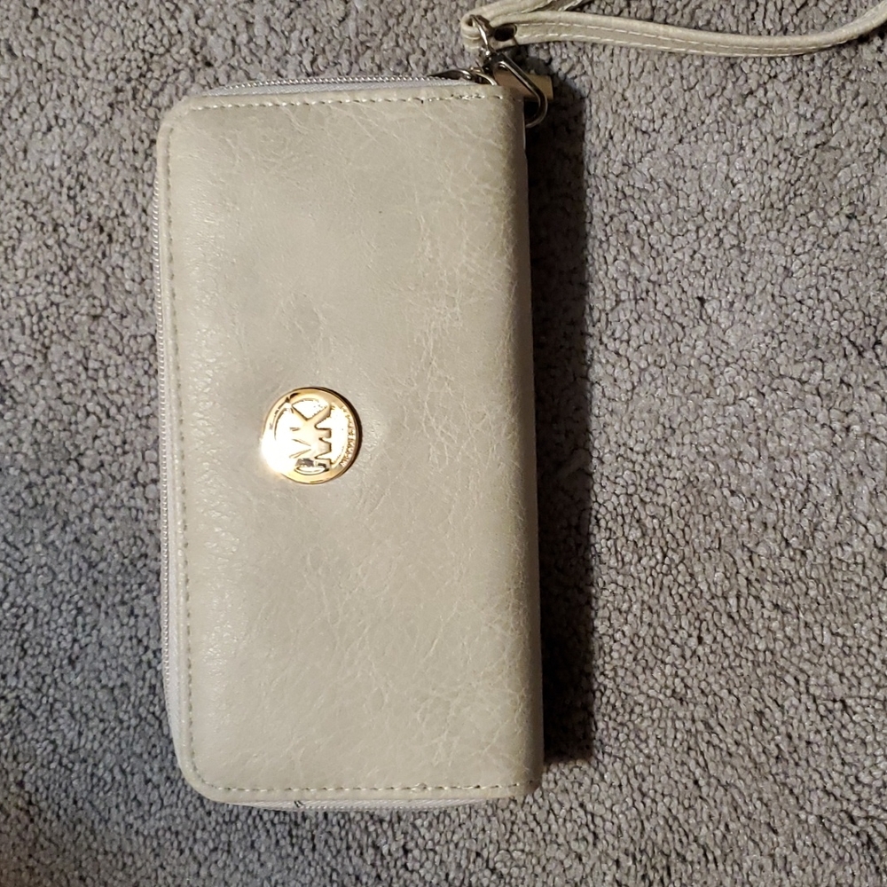 2 NON AUTHENTIC MK wallets. Cute good for a child